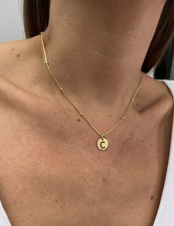 COLLAR ORO LETRA CALA